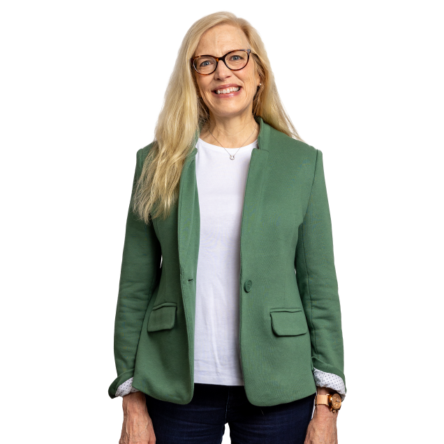 Image of Norfolk Southern a rail transportation company VP of HR standing in a green suit
