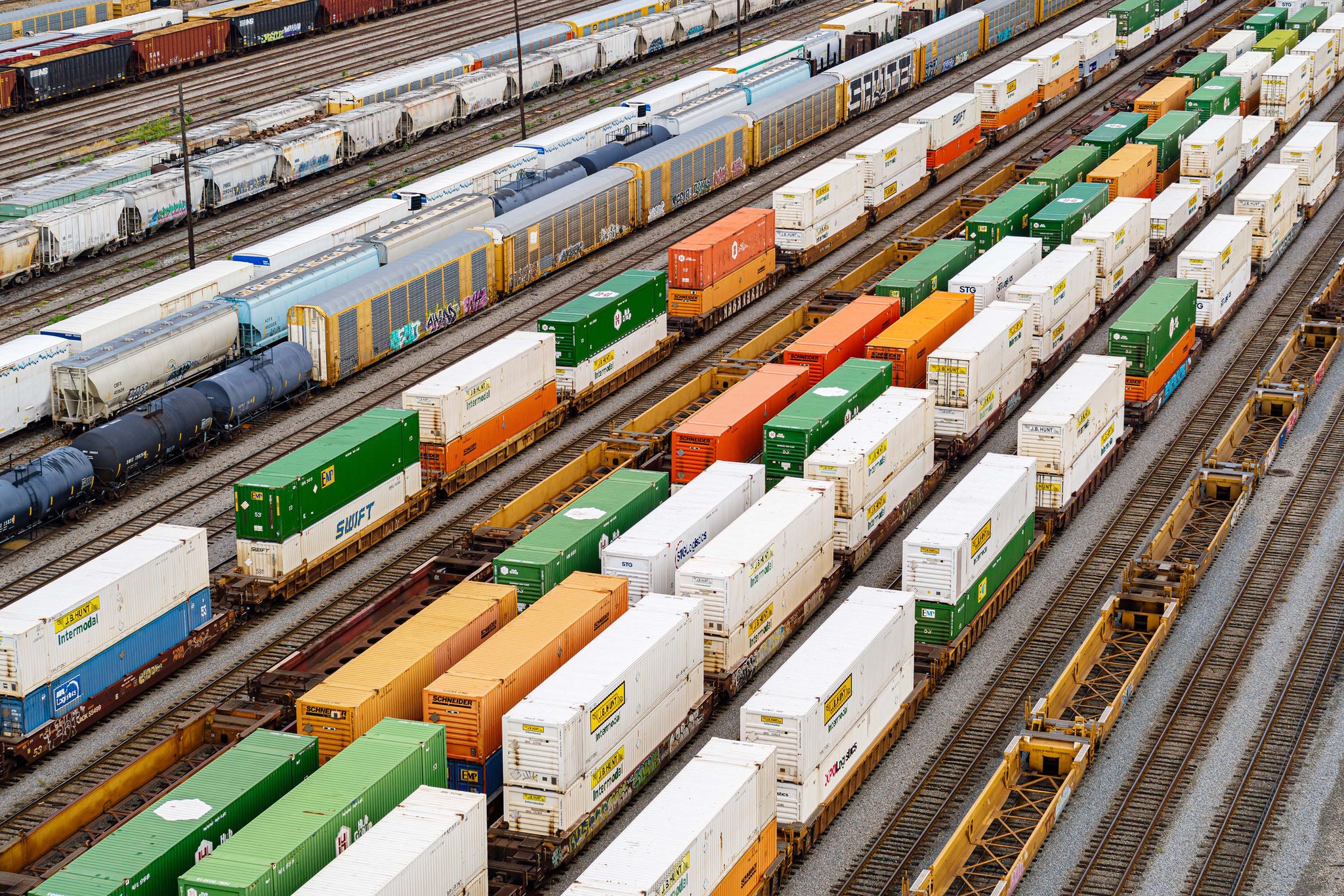 Nine or more Norfolk Southern container trains on tracks all working towards customer centric strateg