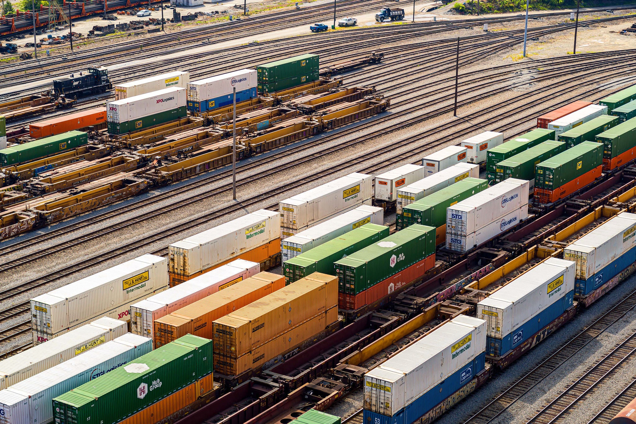 An aerial shot of dozens of intermodal shipping containers parked on Norfolk Southern’s rail lines