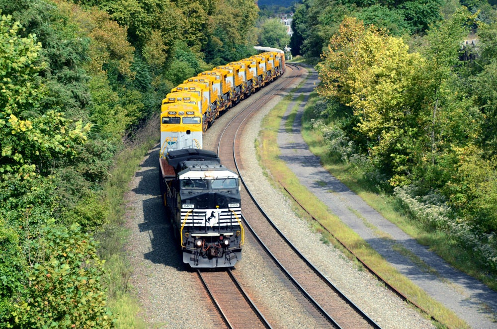 A Thoroughbred train carrying export locomotives bound for,Mozambique, Africa, winds through an S-curve near Huntingdon, Pa.